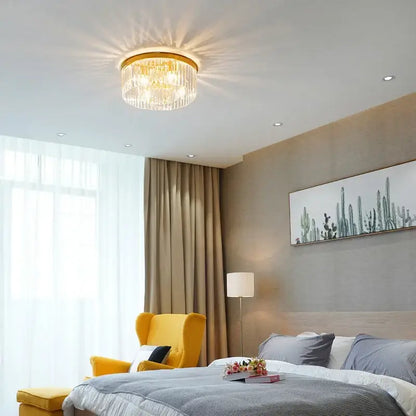 Elegant gold and black crystal round ceiling chandelier with a circular frame and cascading clear glass prisms decorbites crystal round