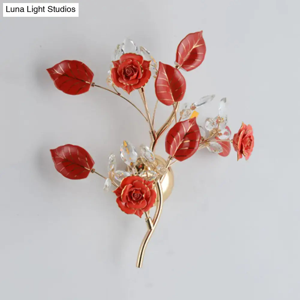 Elegant gold branch wall lamp with vibrant red roses and clear crystal blossoms for direct wired electric bedroom sconce lighting