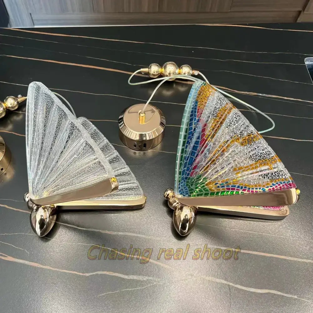 Two triangular clutch bags with gold-tone frames and decorative mesh panels by decorbites butterfly led pendant light decor