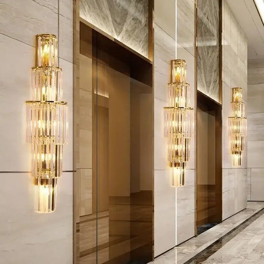 Elegant gold-toned crystal wall lamp with cascading tiers for living room decorbites crystal wall lighting