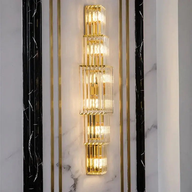 Elegant gold crystal wall lamp featuring stacked metallic cylindrical elements for living room decorbites crystal wall lighting