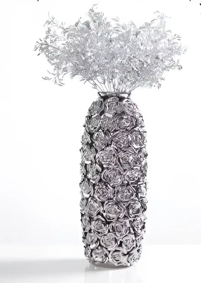 Silver metallic vase with textured raised rose patterns filled with silver-toned dried foliage for elegant gold ceramic rose decorbites centerpiece