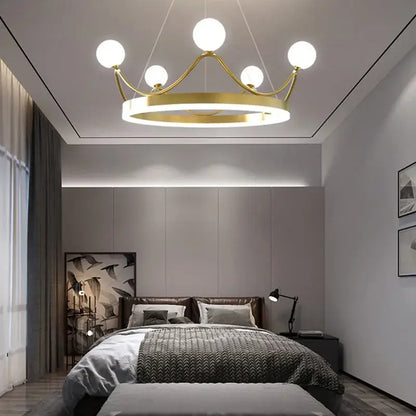 Elegant gold crown led chandelier featuring six white globe lights designed for kids room pendant lighting