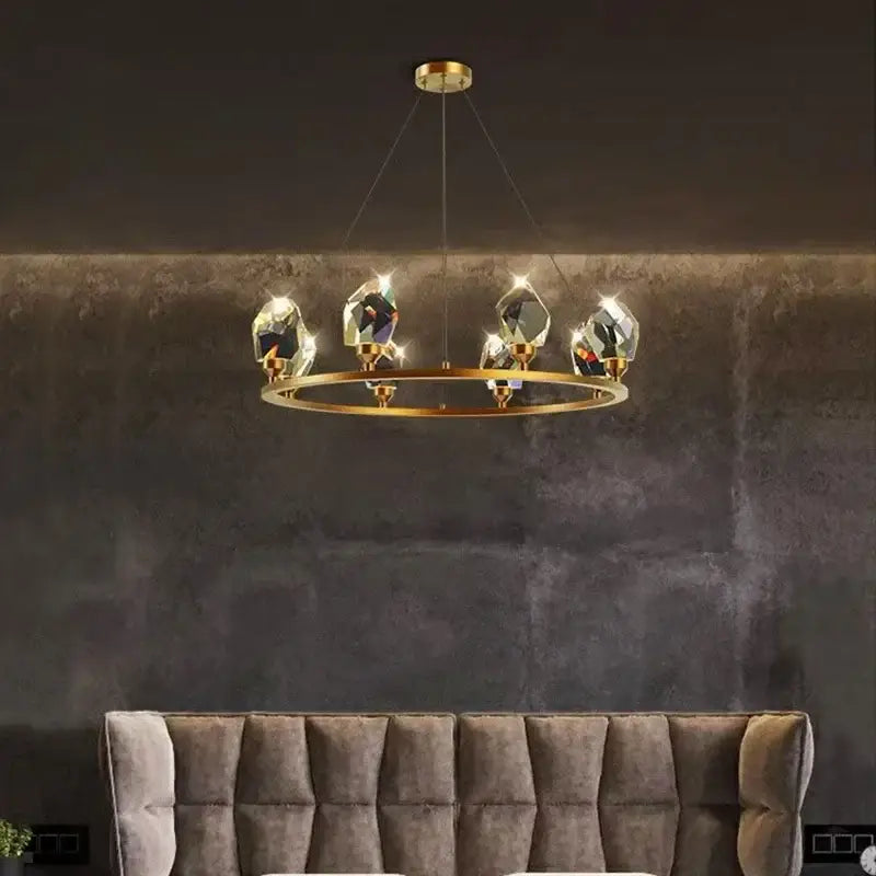 A modern gold-toned pendant light with five faceted crystal pendants for elegant chandelier dining decorbites elegant chandelier