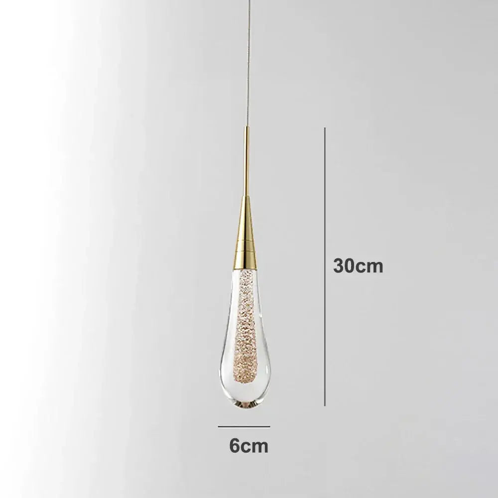Elegant gold crystal glass led pendant light with clear teardrop shade filled with golden beads for dining room decorbites