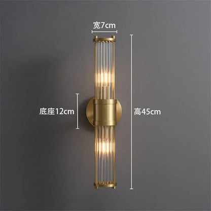 Gold-toned crystal led wall lights with vertical glass tubes and cylindrical brass base for elegant living room decorbites crystal led wall