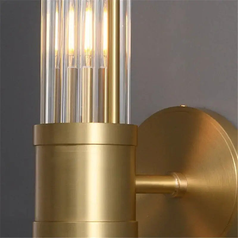 Elegant gold crystal led wall light featuring vertical glass rods and illuminated bulbs for stylish living room decorbites crystal led usage
