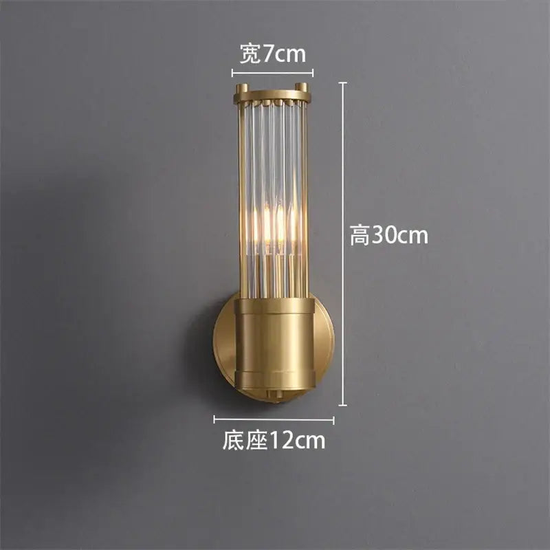 Elegant gold crystal led wall light with vertical glass rods and cylindrical brass base for decorbites crystal led wall decor
