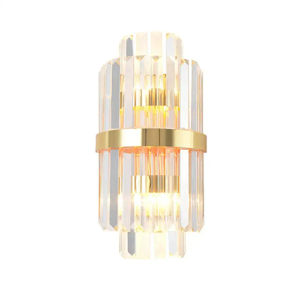 Elegant gold wall sconce light with stacked crystal prisms and central brass band for living room lighting