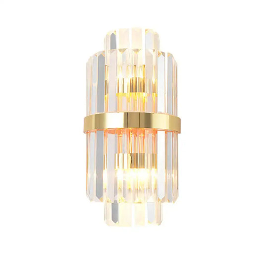 Elegant gold wall sconce light with stacked crystal prisms and central brass band for living room lighting