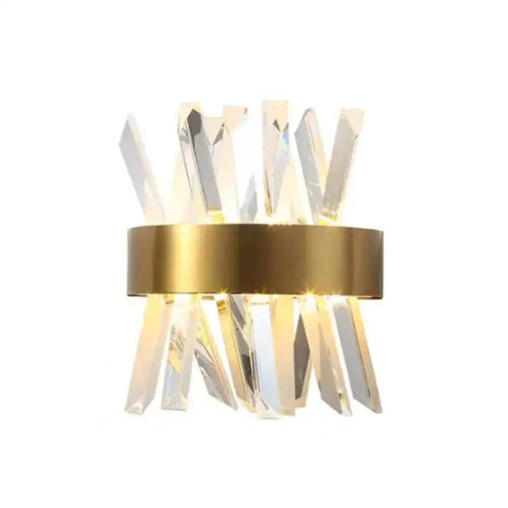 Elegant gold crystal prism wall sconce light with gold-toned metal ring and clear faceted glass prisms for living room lighting