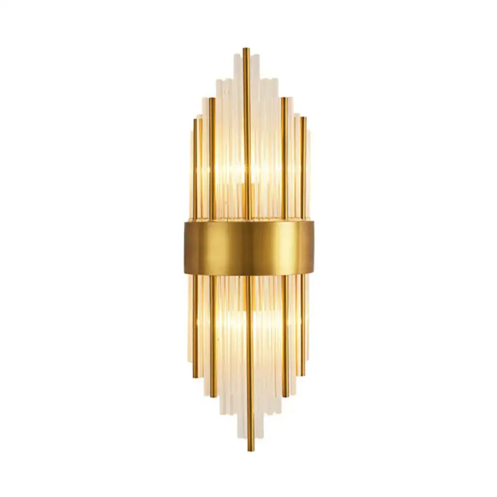 Elegant gold wall sconce light with vertical glass rods and central brass band for living room lighting