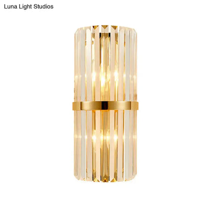 Elegant gold crystal prism wall sconce light with vertical rods and a gold-toned band for living room lighting
