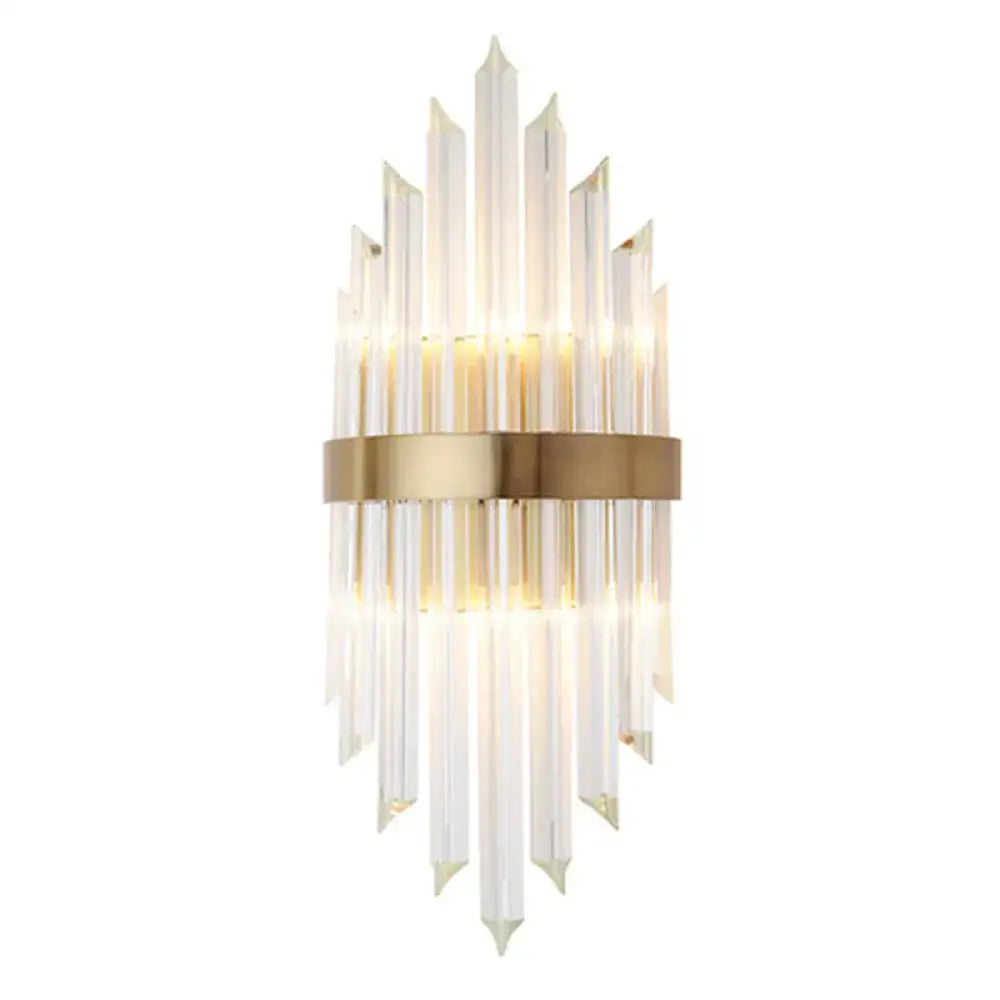 Elegant gold wall sconce light featuring clear faceted glass rods and central brass band for living room lighting