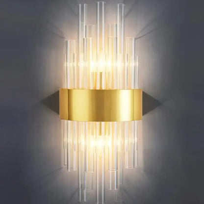 Elegant gold crystal prism wall sconce light with gold metallic base and clear glass tubes for living room lighting