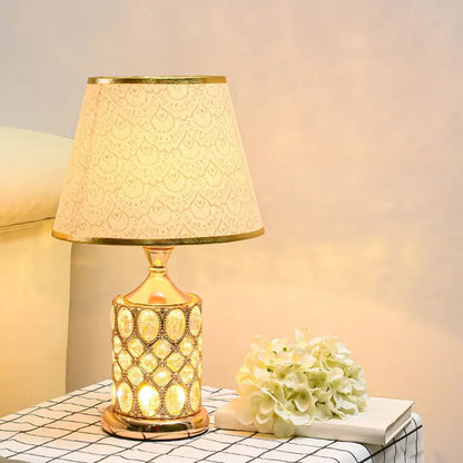 Elegant gold crystal table lamp with beaded oval ceramic body and lace-like shade for bedroom decorbites crystal table ambiance