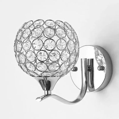 Elegant gold decorbites crystal wall sconce with a sparkling chrome finish and spherical crystal globe design for bedroom lighting