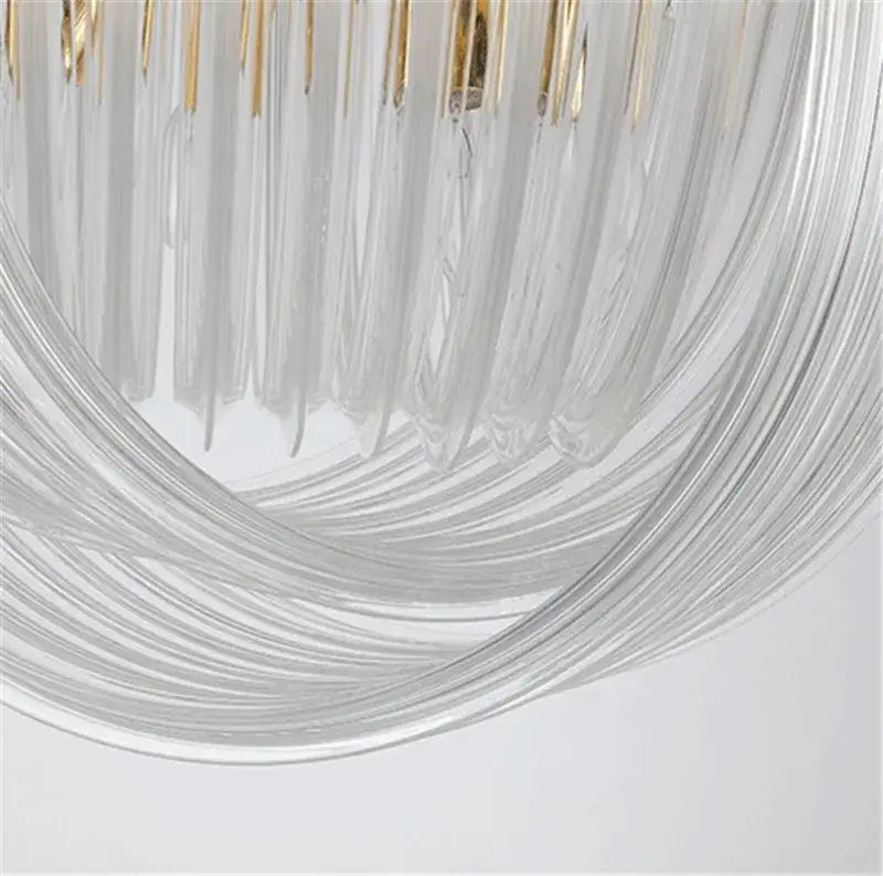 Elegant gold glass tube pendant chandelier with clear glass and gold-toned accents for dining room lighting