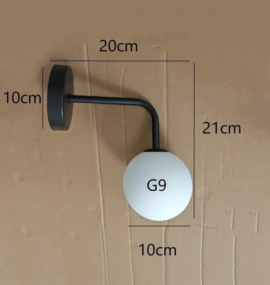 Black metal wall lamp with frosted white spherical glass shade g9 for decorbites elegant glass wall decor