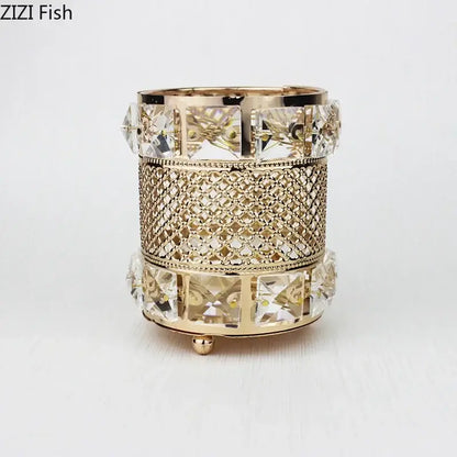 Elegant gold-toned hollow glass jar candle holder with crystal accents and intricate mesh detailing for decorative use