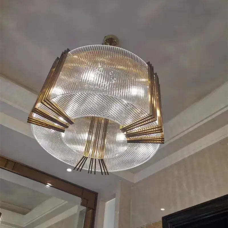 Elegant gold lustre crystal pendant light with tiered clear ribbed glass panels and gold-toned metal accents for dining room decorbites elegant gold