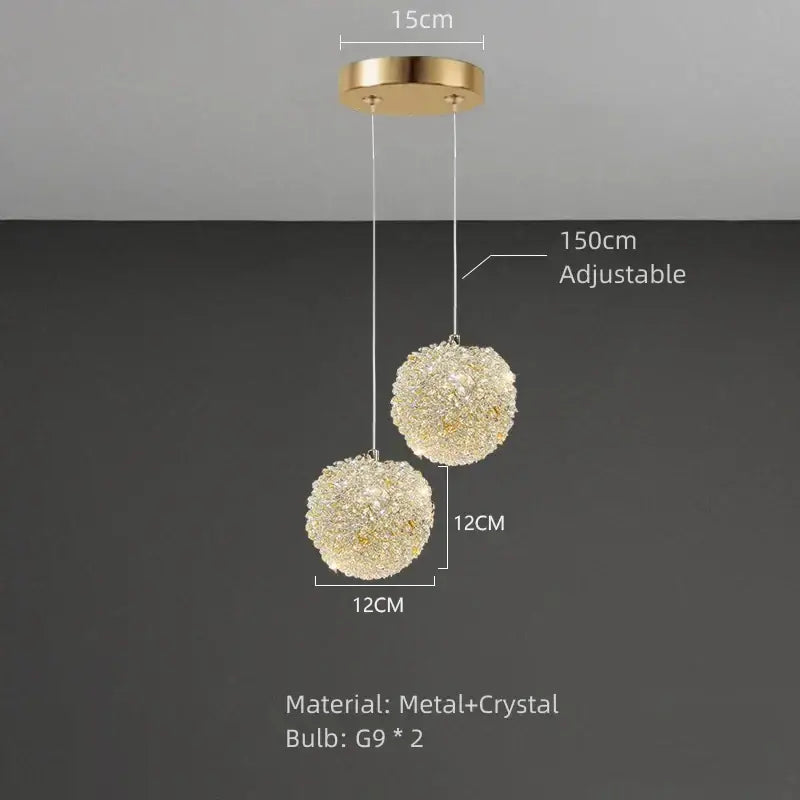 Elegant gold metal crystal pendant light with two spherical crystal clusters hanging from circular mount for dining room decorbites gold metal