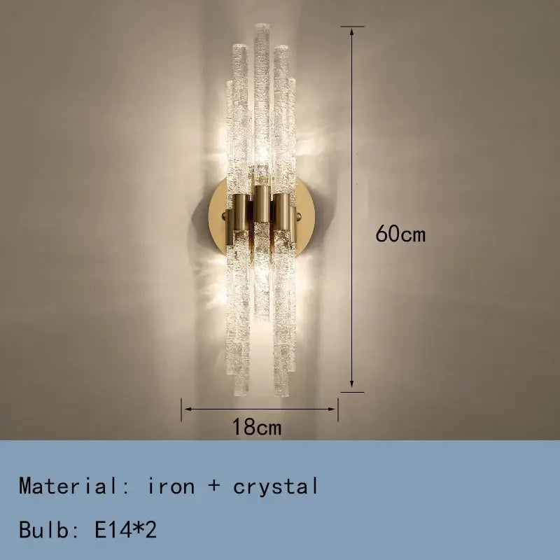 Elegant gold metal wall sconce with five textured crystal rods on a circular brass base for decorbites gold metal lighting