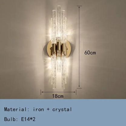 Elegant gold metal wall sconce with five textured crystal rods on a circular brass base for decorbites gold metal lighting