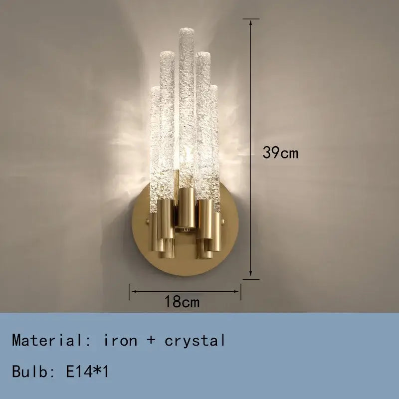 Elegant gold metal wall sconce with five textured crystal rods on a circular brass base by decorbites gold metal