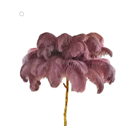 A decorbites elegant ostrich feather floor lamp with plush dusty rose feathers and a slender gold-toned stem