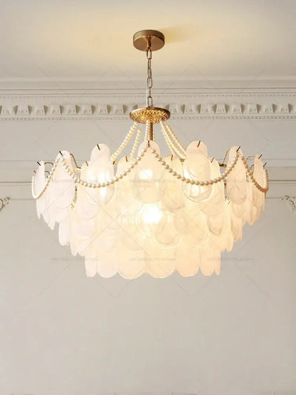 Delicate layered chandelier garden light with translucent white glass shells and gold-toned metal for dining room