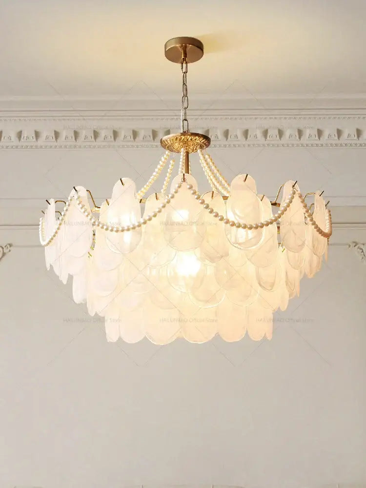 Elegant gold pearl shell chandelier garden light with translucent white glass shells and gold metal accents for dining room