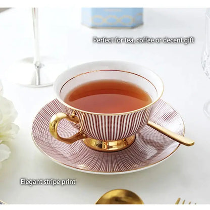 A delicate porcelain teacup with maroon and white stripes and gold trim from decorbites gold porcelain tea set dining room rack