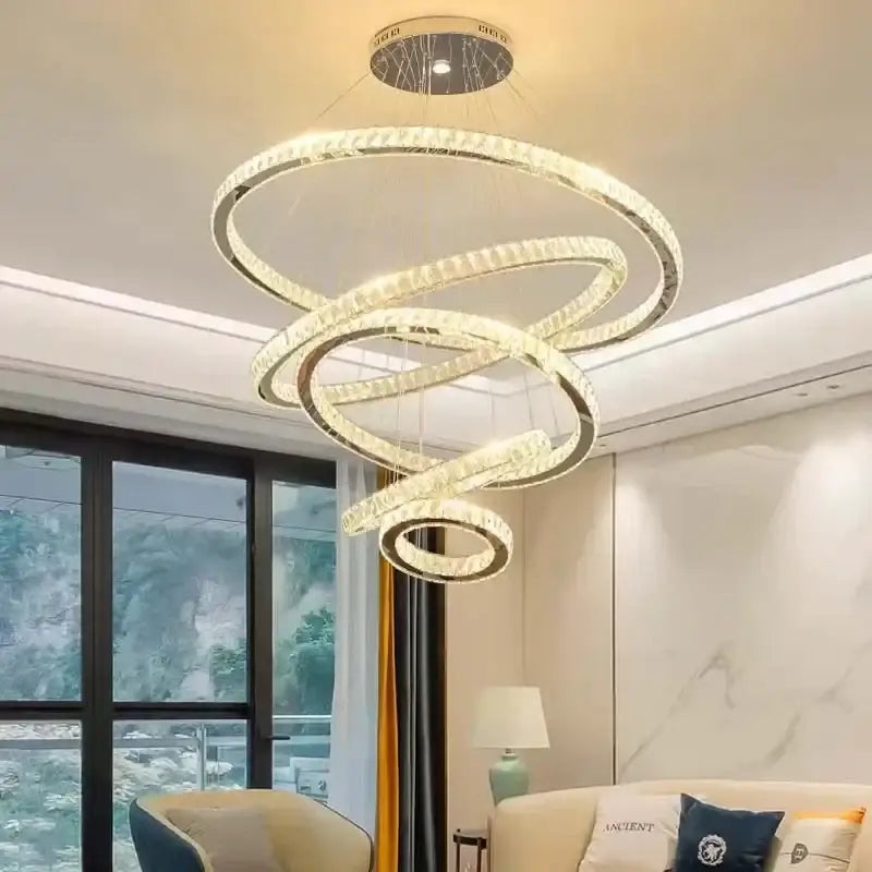 Modern spiral gold rings chandelier with clear crystal and metallic frames for elegant dining room decorbites elegant gold