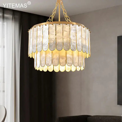 Elegant gold shell chandelier by decorbites featuring layered translucent mother of pearl panels with scalloped edges