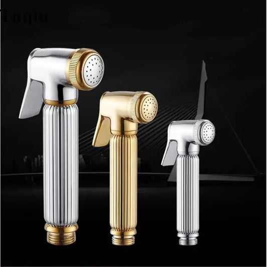 Three elegant handheld bidet sprayers in gold and silver metallic finishes for bathroom use in an elegant kit
