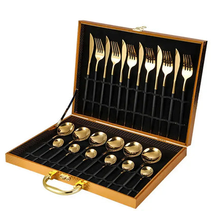 Elegant gold stainless steel cutlery set with black handles neatly arranged in a wooden carrying case gift box