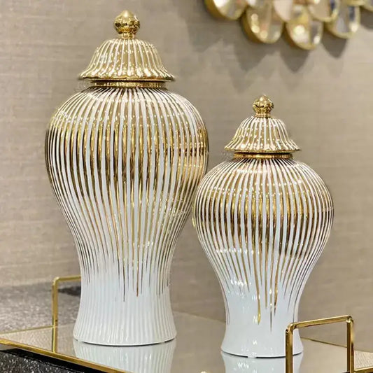 Elegant gold striped ceramic ginger jars with white bodies and matching golden lids displayed as living room decorbites gold striped storage