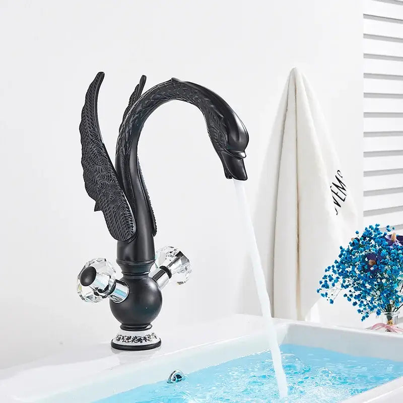 Elegant gold swan basin faucet with black swan shape crystal knobs and ornate decorbites gold swan detailing for bathroom use