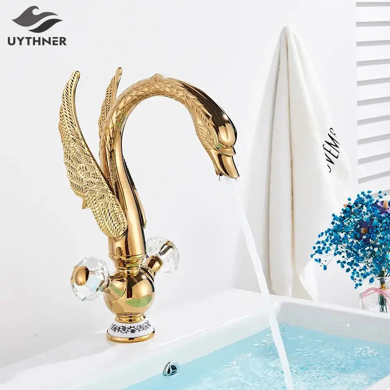Elegant gold swan basin faucet with intricate feather detailing and crystal knobs for bathroom decorbites gold swan design
