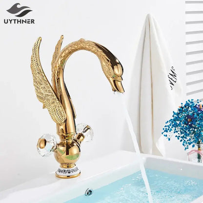 Elegant gold swan basin faucet with intricate feather detailing and crystal knobs for bathroom decorbites gold swan design