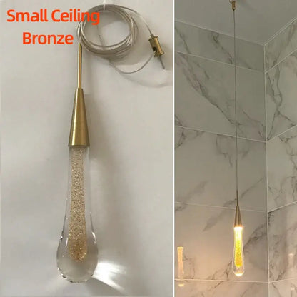 Elegant gold teardrop crystal glass pendant light with bronze finish and golden glitter for dining room decorbites crystal glass