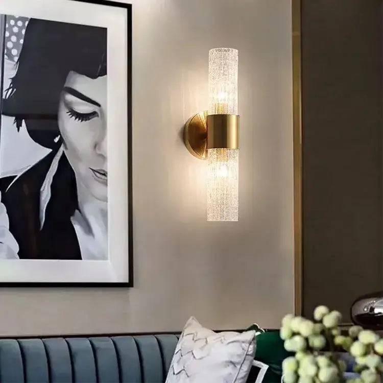 Elegant gold textured glass wall lamp with translucent cylinder for warm bedroom lighting by Decorbites elegant crystal
