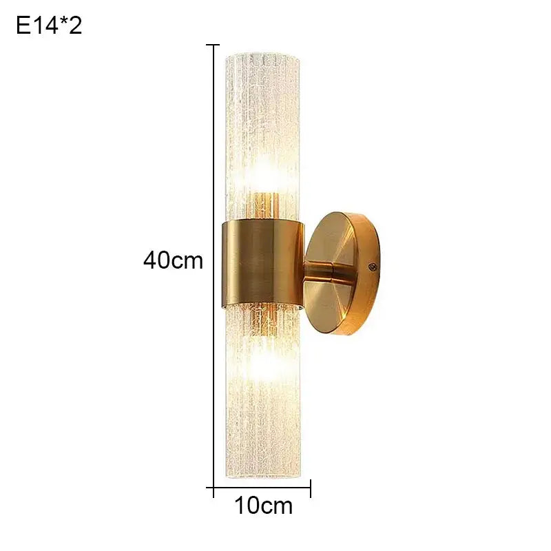 Elegant gold textured glass wall lamp with translucent cylinder and dual light sources for warm bedroom lighting decorbites elegant crystal