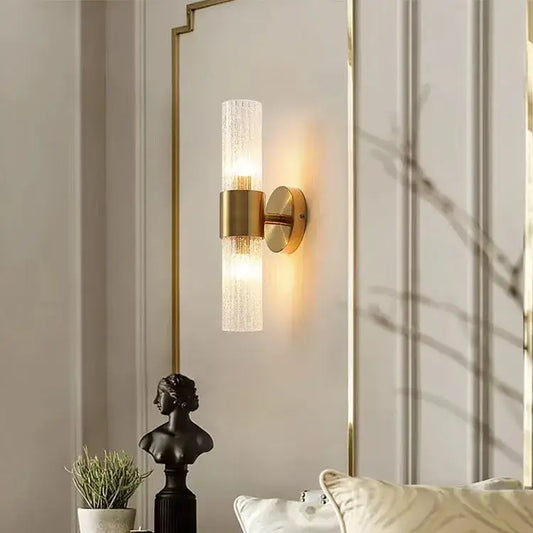 Elegant gold wall lamp with textured frosted glass cylinder diffusing warm light decorbites elegant crystal led decor