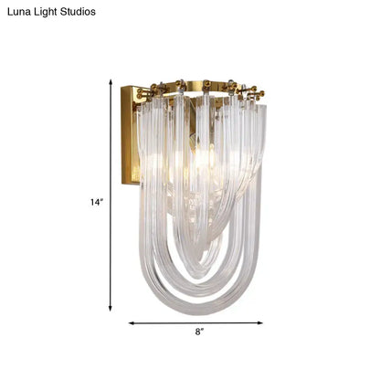 Elegant gold wall lamp with a twisted crystal shade and cascading clear glass tubes for bedroom lighting