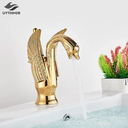 Elegant golden swan faucet bathroom mixer tap with detailed feathered wings and polished metallic finish