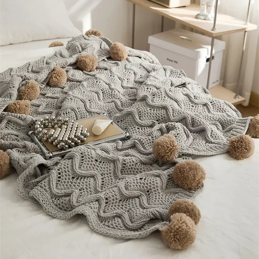 Elegant gray chenille throw blanket with light gray wavy texture and beige elegant chenille pompons for decorbites decor