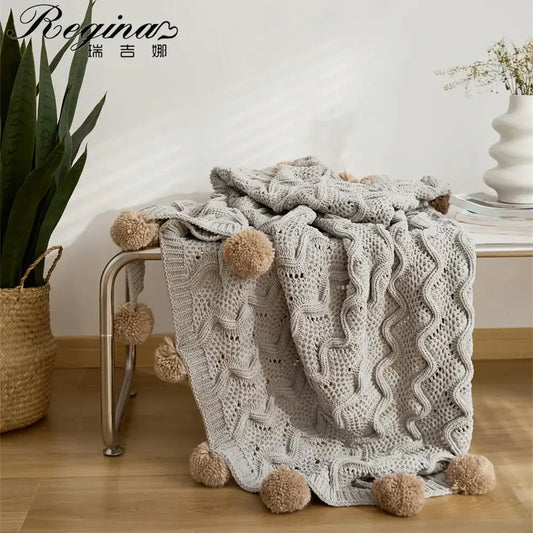 Elegant gray chenille throw blanket with light gray knit cable pattern and beige elegant chenille pompons for decorbites decor