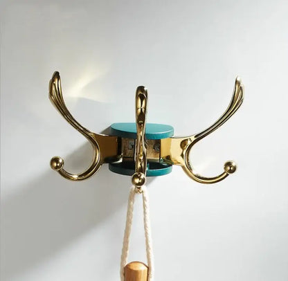Elegant green gold zinc alloy three-hook coat hook with a teal circular base for bathroom wall mount use